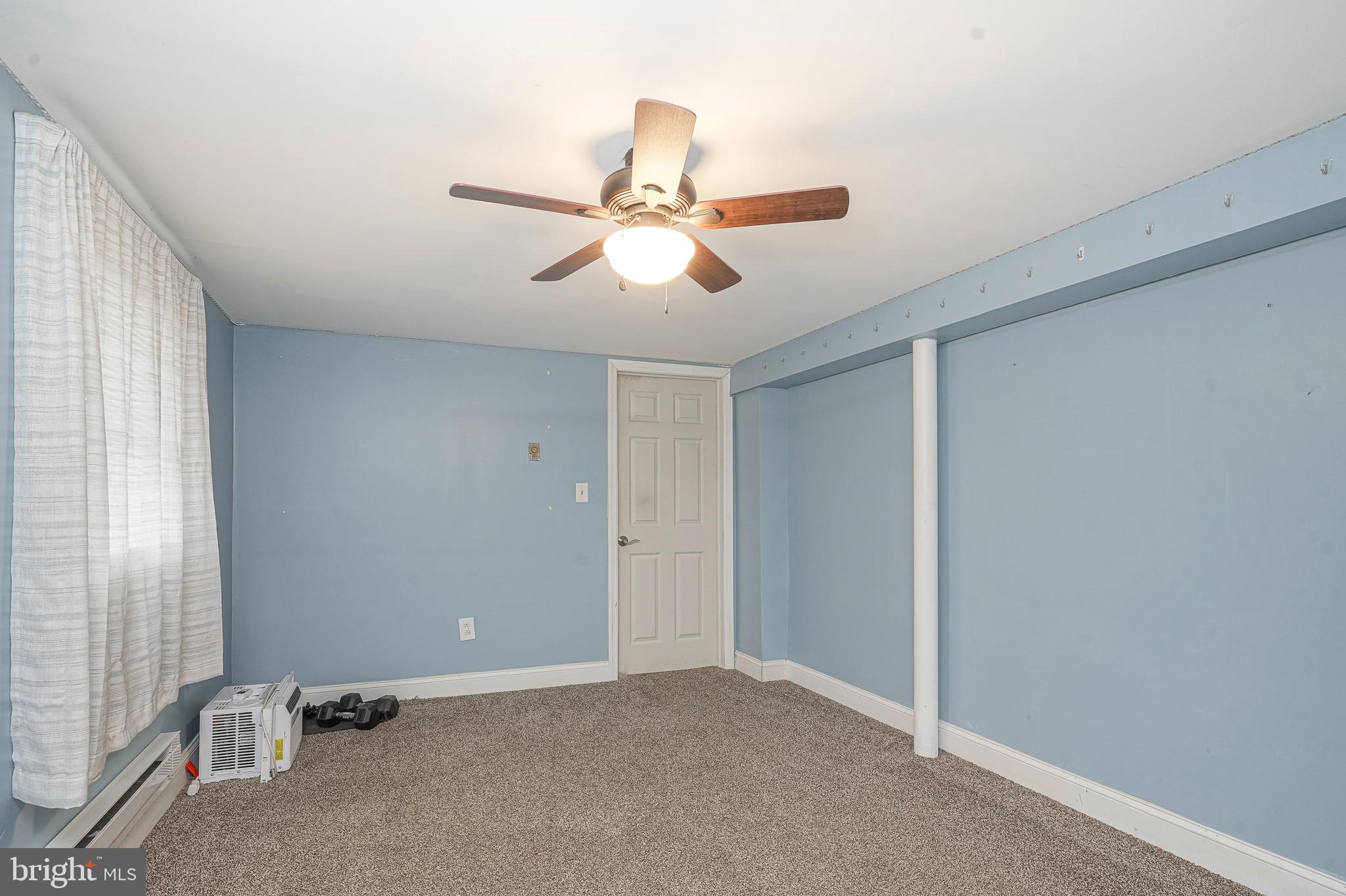 1304 Morgan Road Williamstown, NJ 08094 - Photo 18 of 32 an empty room with windows and fan