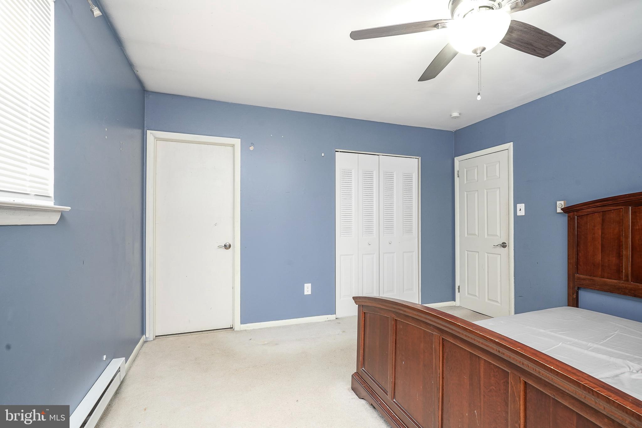1304 Morgan Road Williamstown, NJ 08094 - Photo 24 of 32 a bedroom with a bed and a chandelier