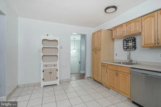 a kitchen with stainless steel appliances a sink and cabinets