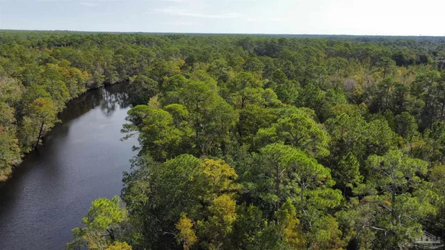 a view of a lake with a yard