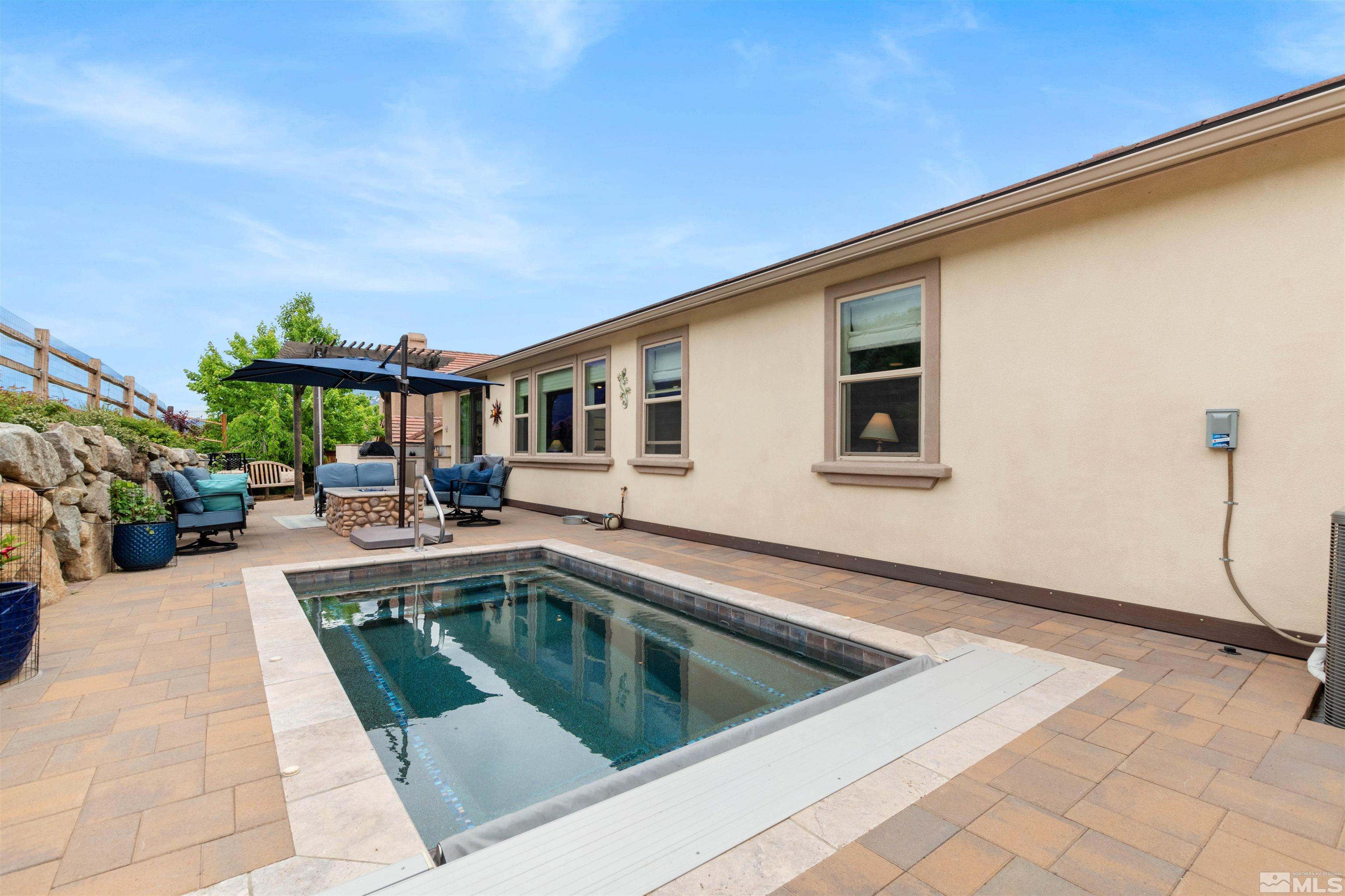 1876 Scott Valley Road Reno, NV 89523 - Photo 27 of 31 a view of swimming pool with outdoor seating and plants