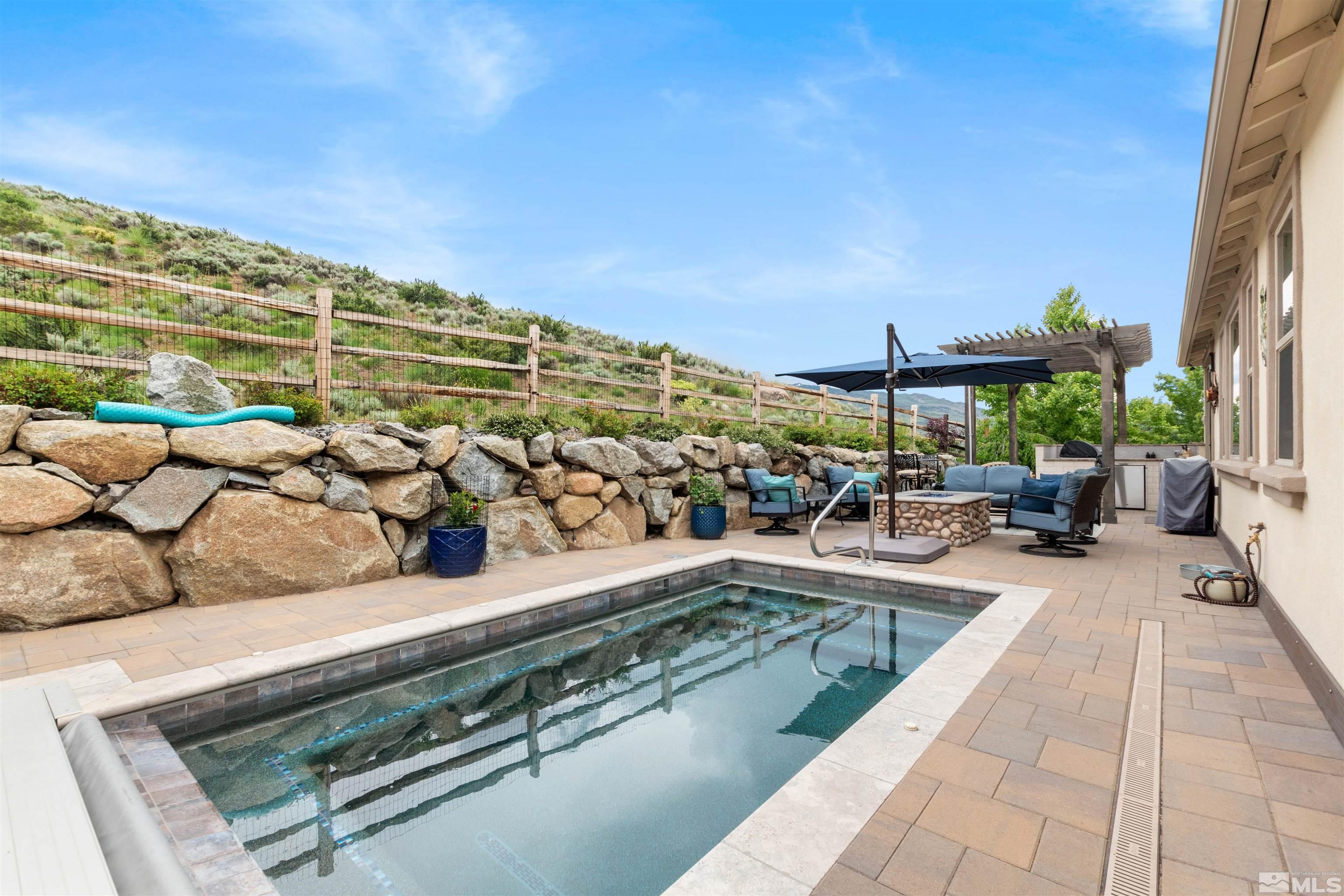1876 Scott Valley Road Reno, NV 89523 - Photo 28 of 31 a view of swimming pool with outdoor seating and a tub
