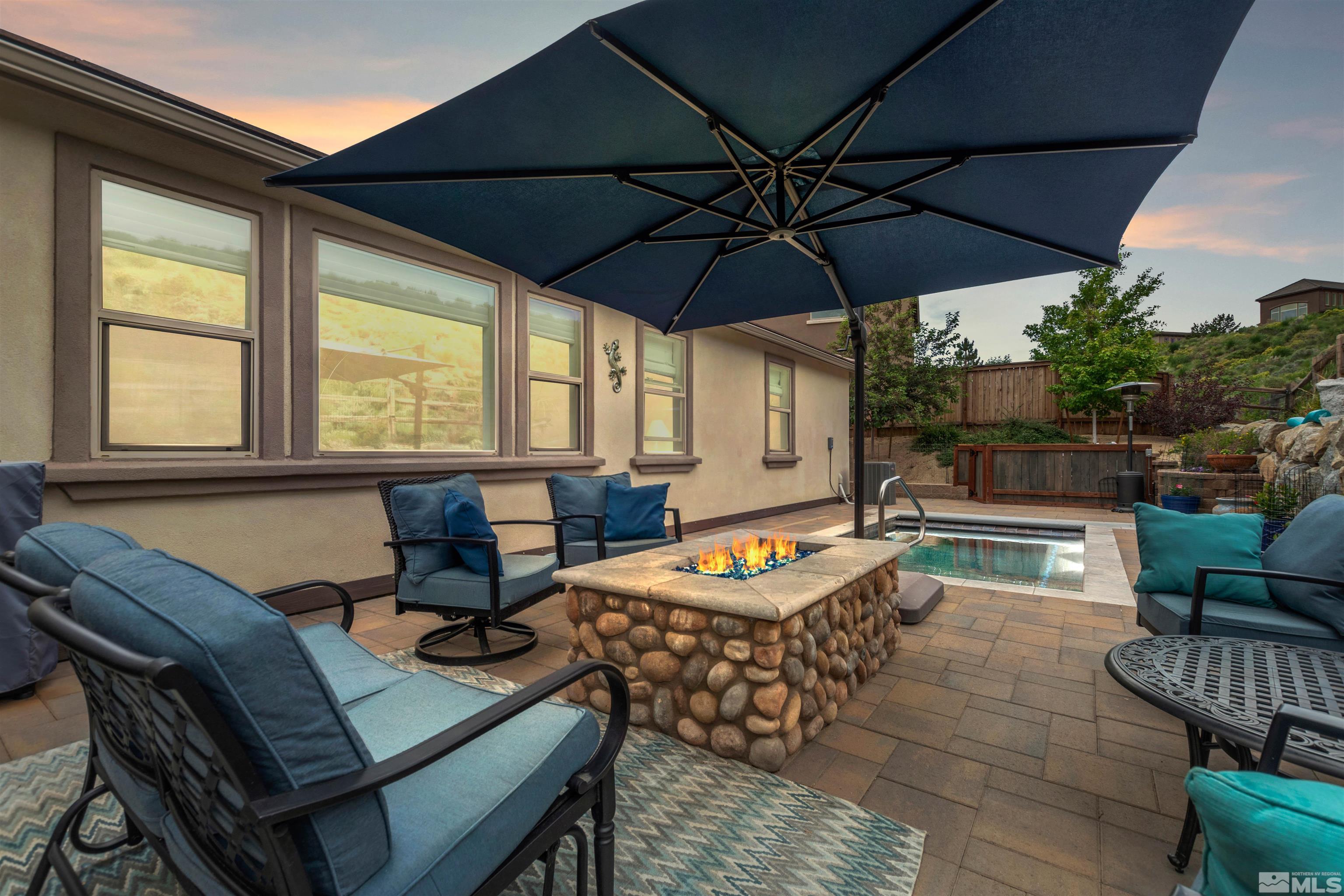 1876 Scott Valley Road Reno, NV 89523 - Photo 29 of 31 a outdoor space with patio the couches and pool with an umbrella