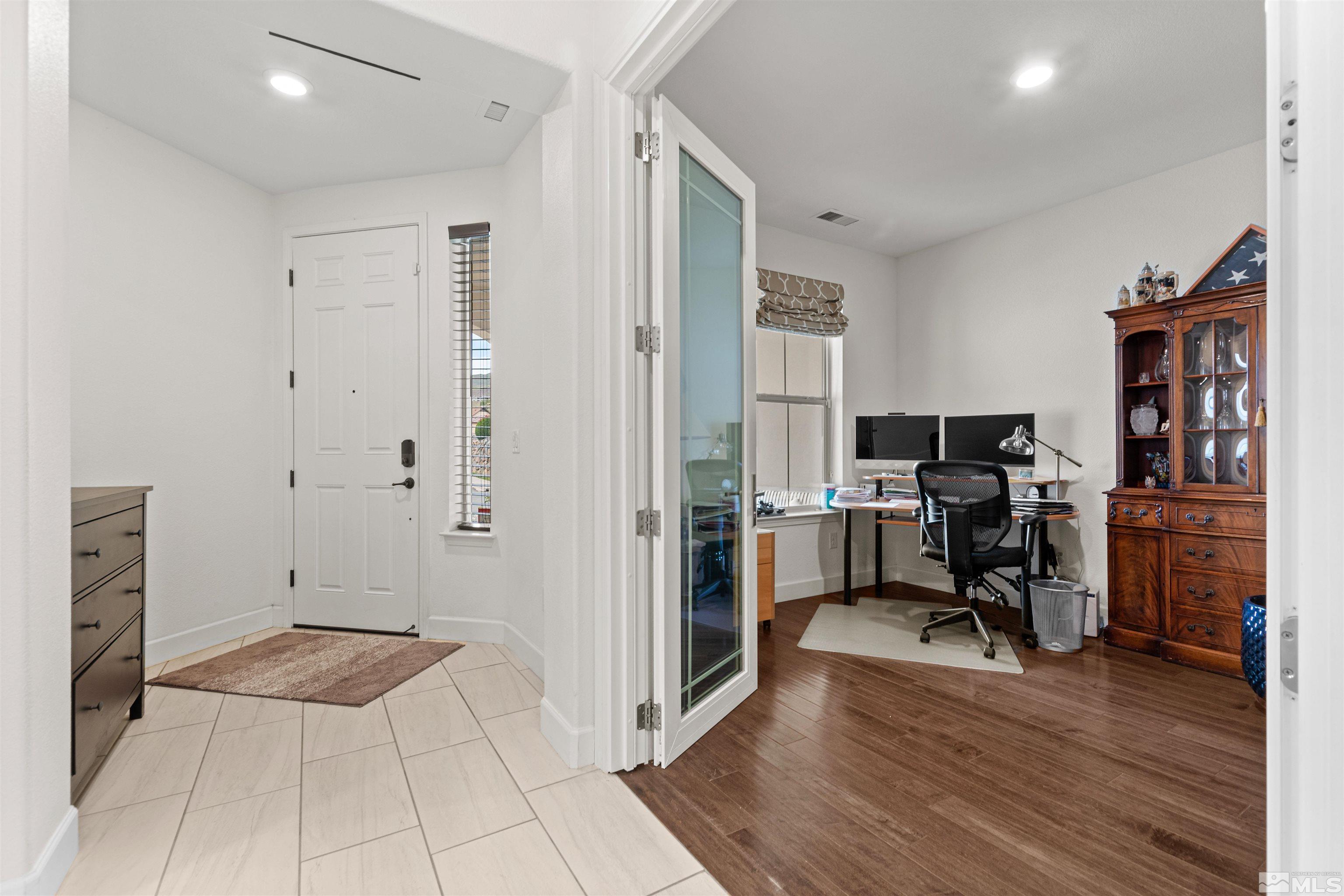 1876 Scott Valley Road Reno, NV 89523 - Photo 4 of 31 a view of a workspace with furniture and wooden floor