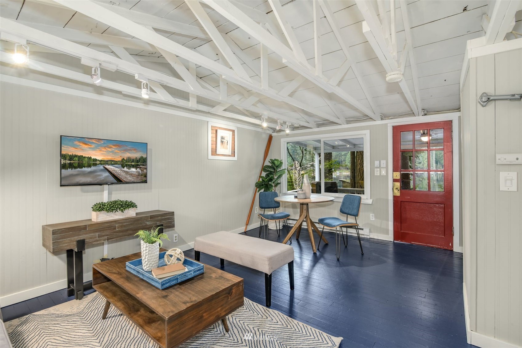 7327 Lake Alice Road Southeast Fall City, WA 98024 - Photo 22 of 35 a living room with furniture and a wooden floor