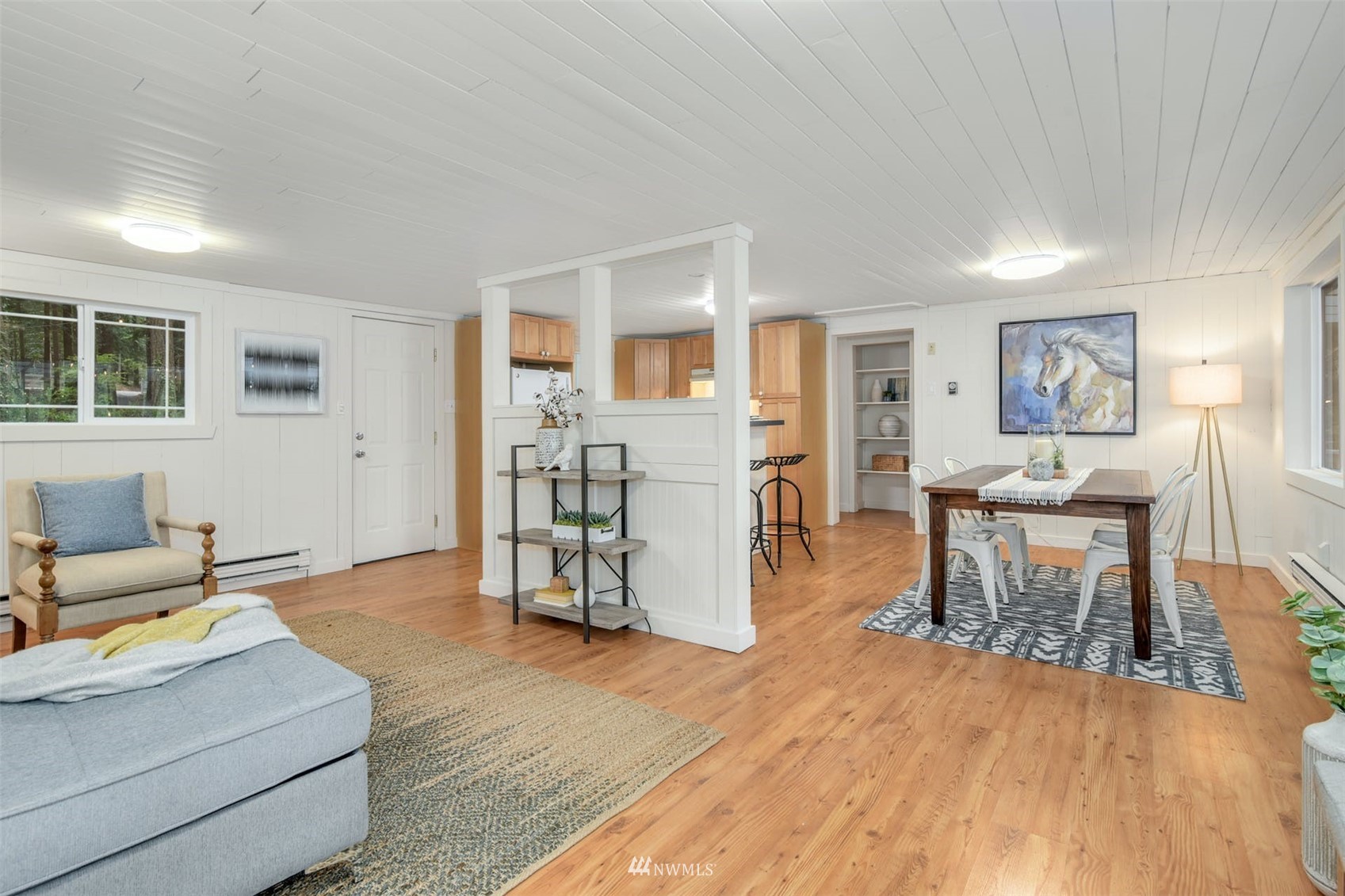 7327 Lake Alice Road Southeast Fall City, WA 98024 - Photo 6 of 35 a living room with furniture and a wooden floor