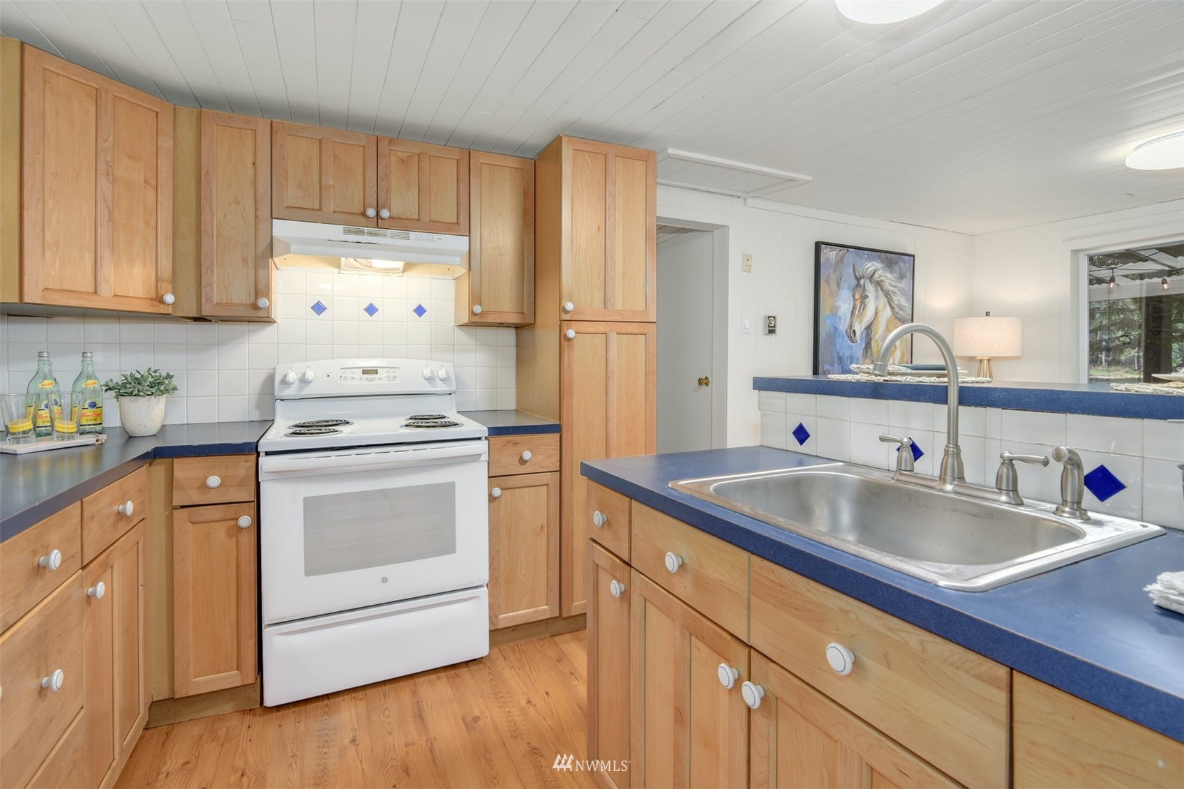 7327 Lake Alice Road Southeast Fall City, WA 98024 - Photo 9 of 35 a kitchen with appliances cabinets and a sink