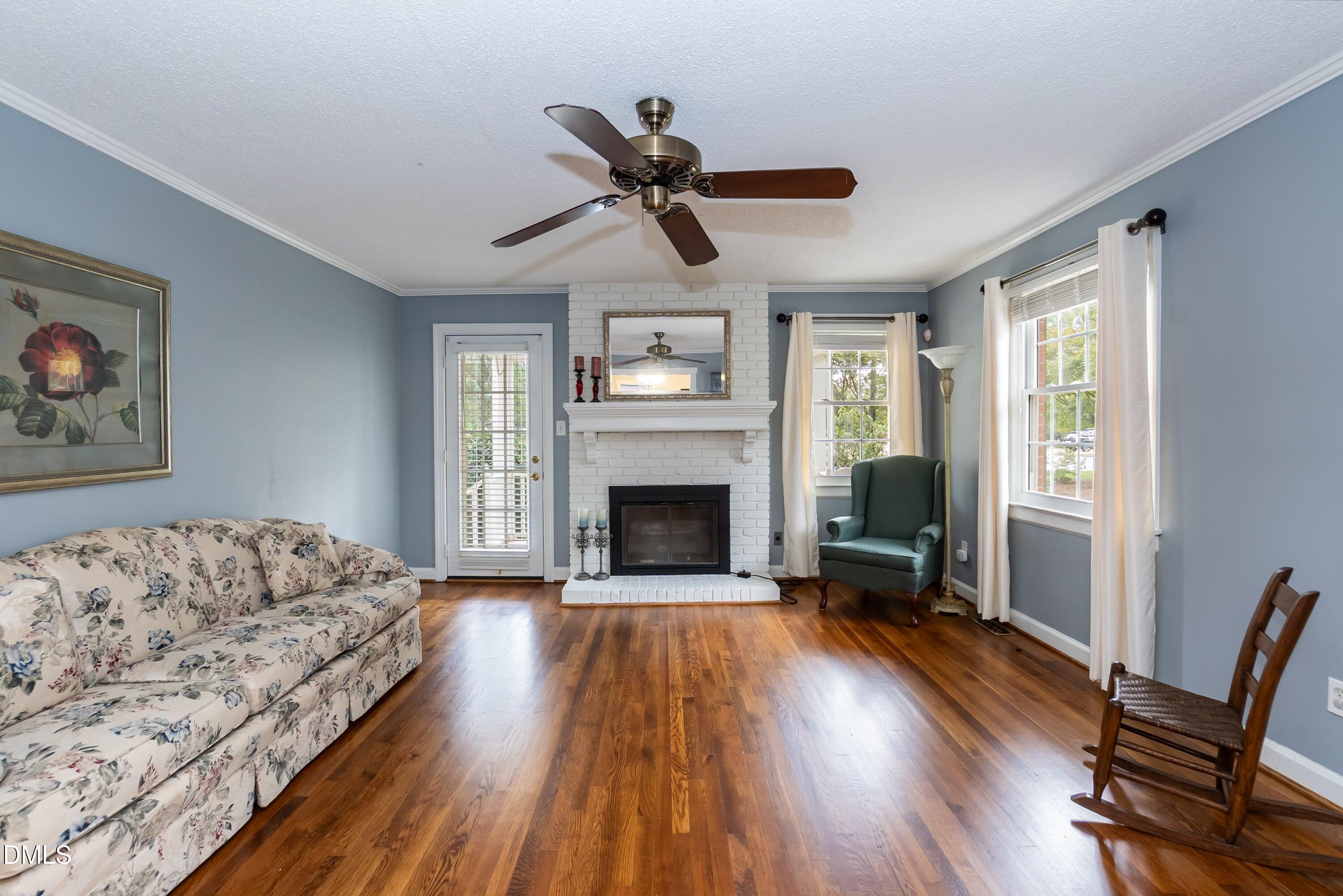 700 St Marys Street Garner, NC 27529 - Photo 11 of 51 a living room with furniture fireplace and window