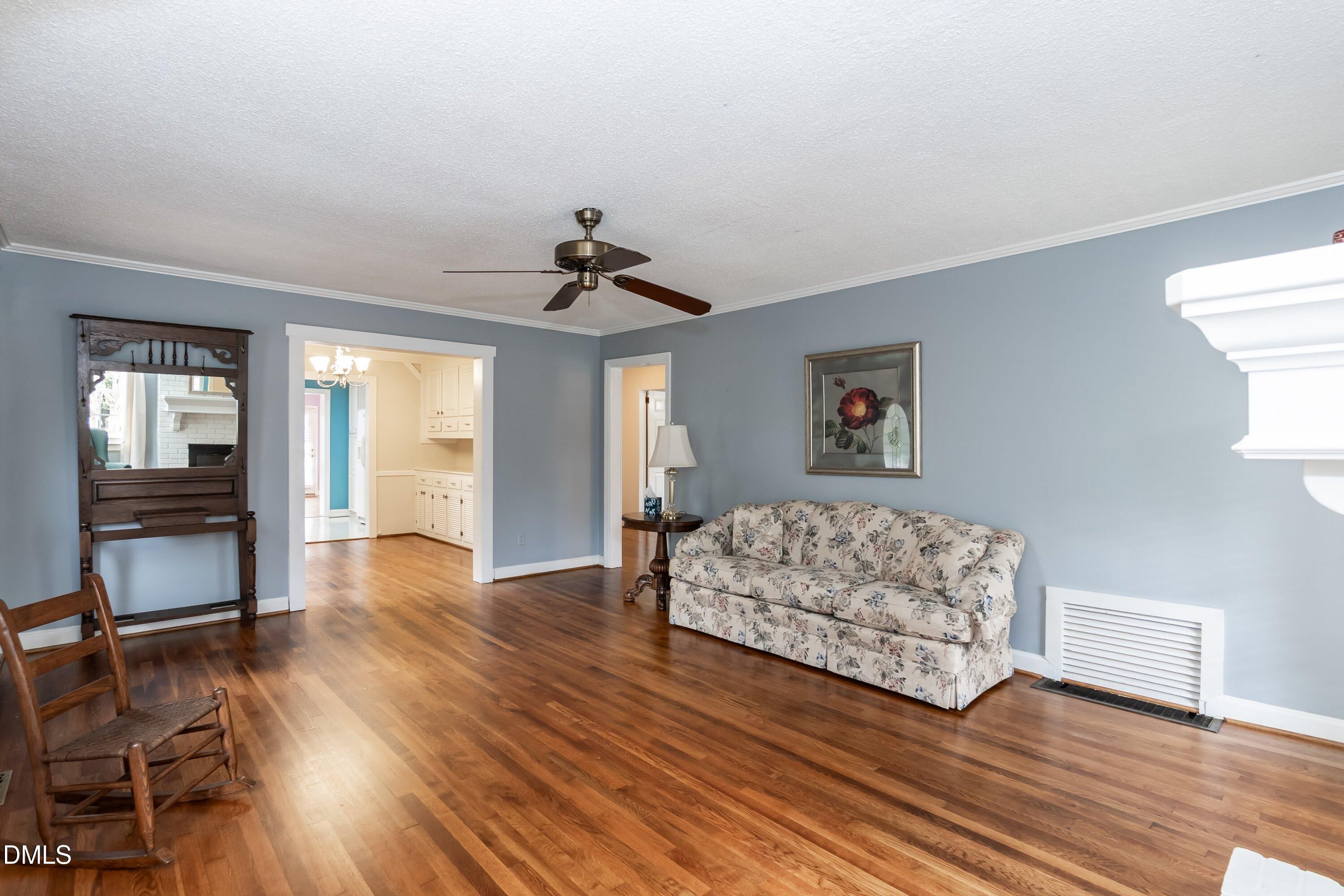 700 St Marys Street Garner, NC 27529 - Photo 13 of 51 a living room with furniture and wooden floor