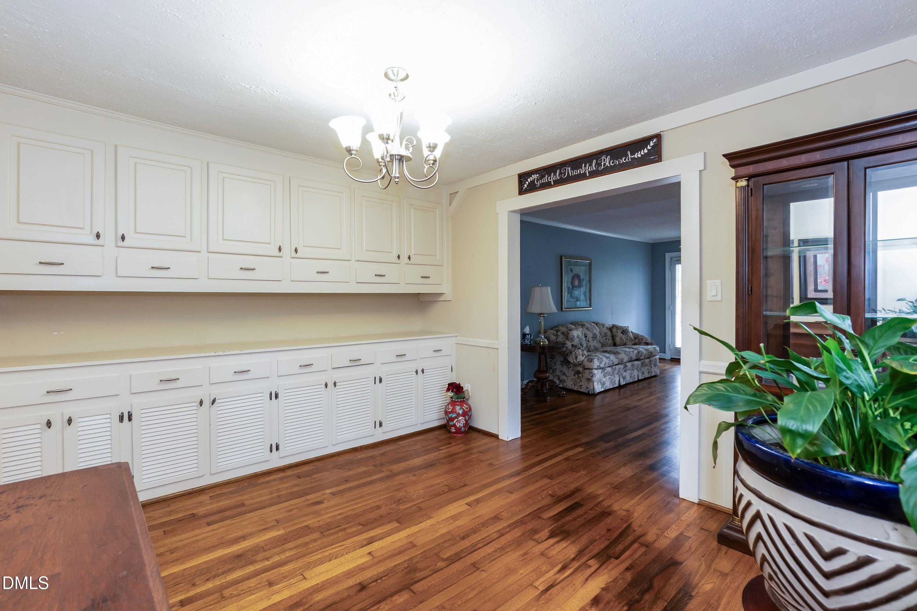 700 St Marys Street Garner, NC 27529 - Photo 15 of 51 a view of a hallway with wooden floor and staircase