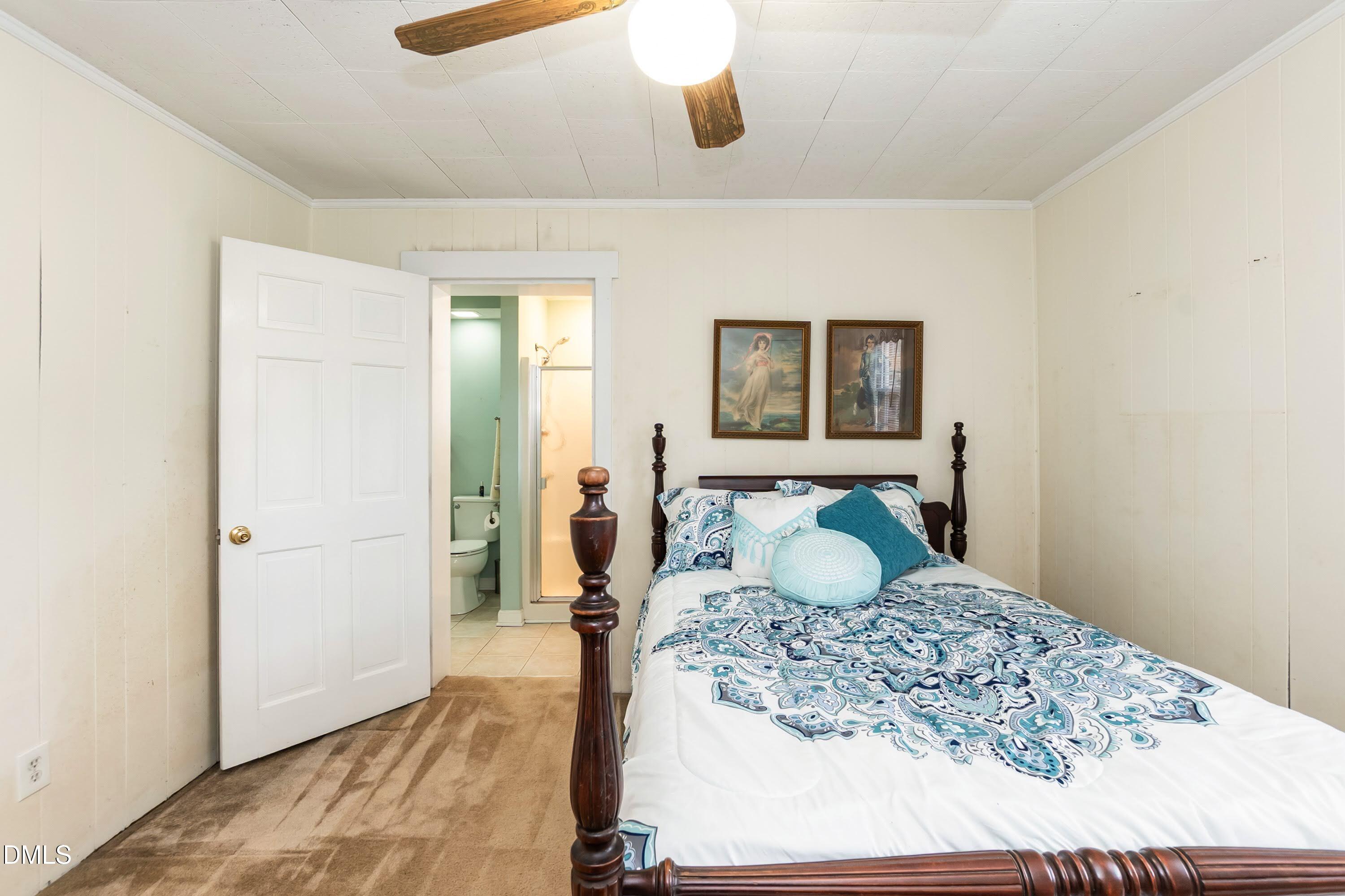 700 St Marys Street Garner, NC 27529 - Photo 24 of 51 a bedroom with a bed and a dresser