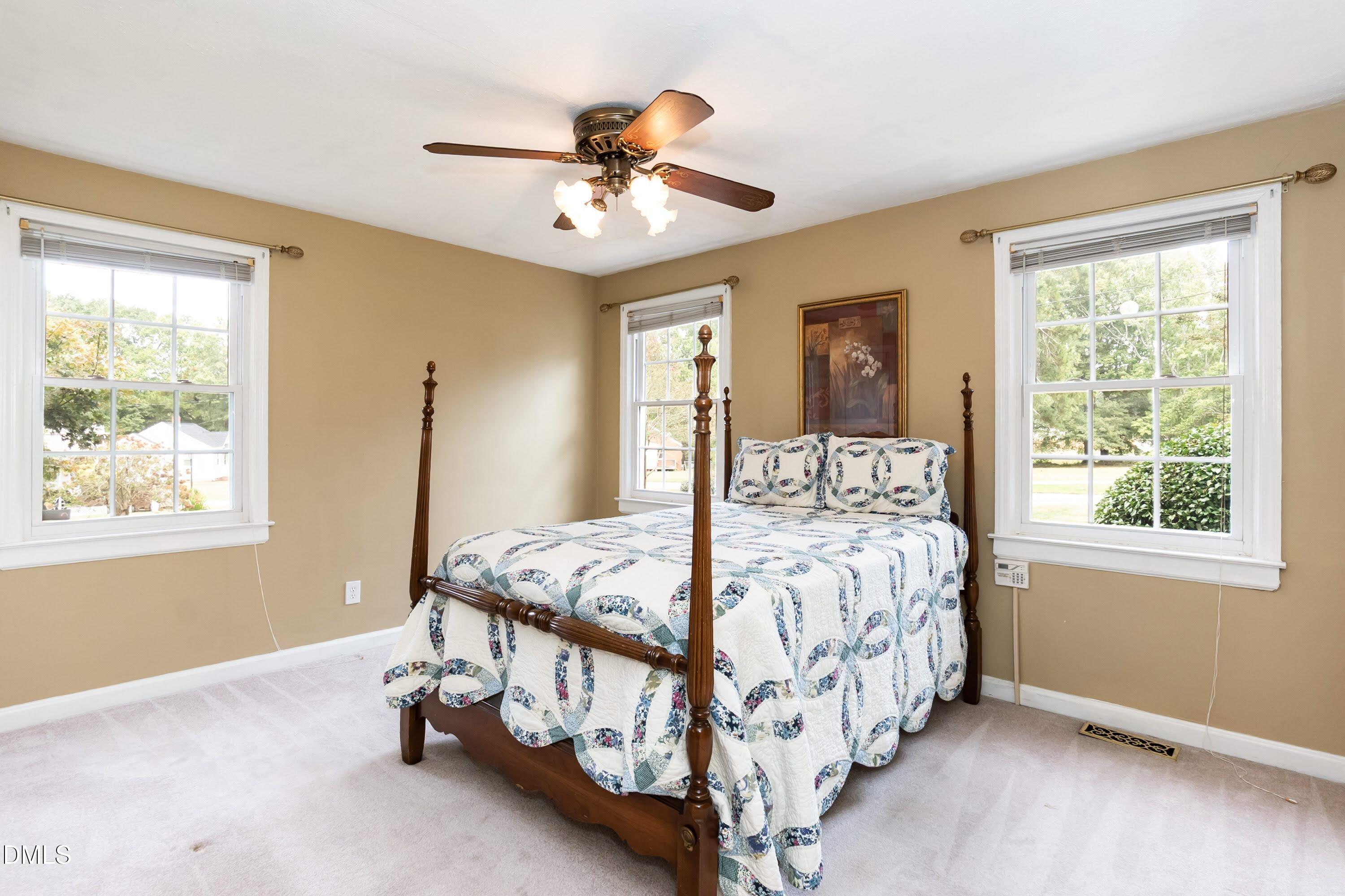 700 St Marys Street Garner, NC 27529 - Photo 29 of 51 a bed sitting in a bedroom next to a window
