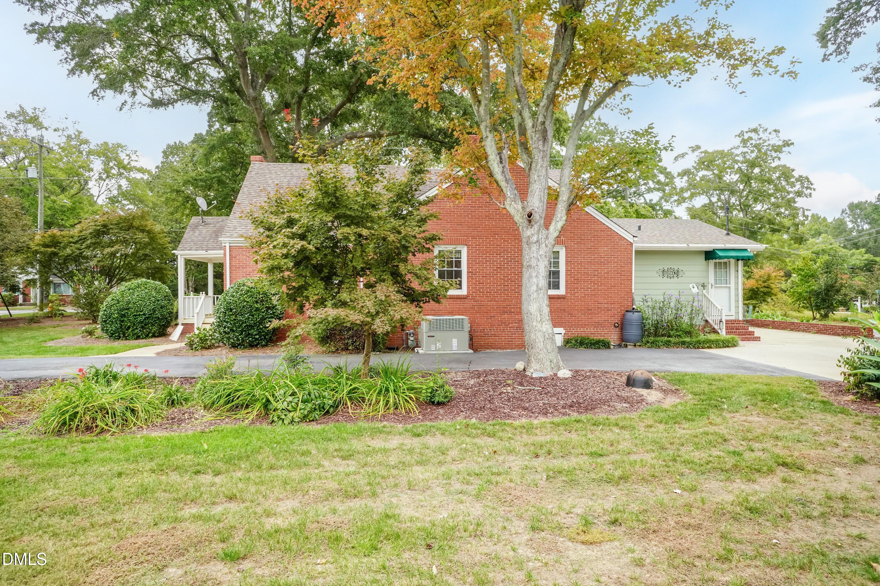 700 St Marys Street Garner, NC 27529 - Photo 36 of 51 a front view of a house with a yard and an trees
