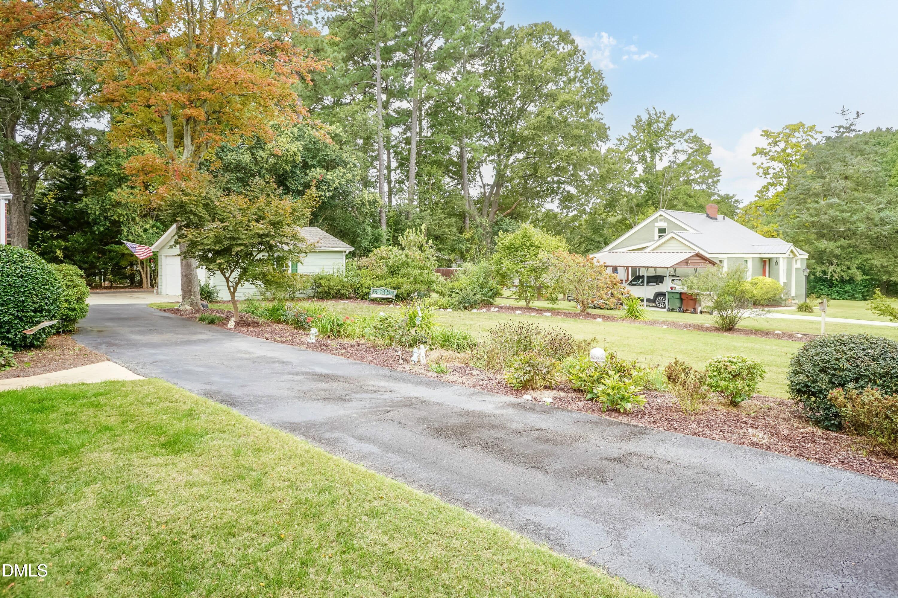 700 St Marys Street Garner, NC 27529 - Photo 40 of 51 a front view of house with yard and green space