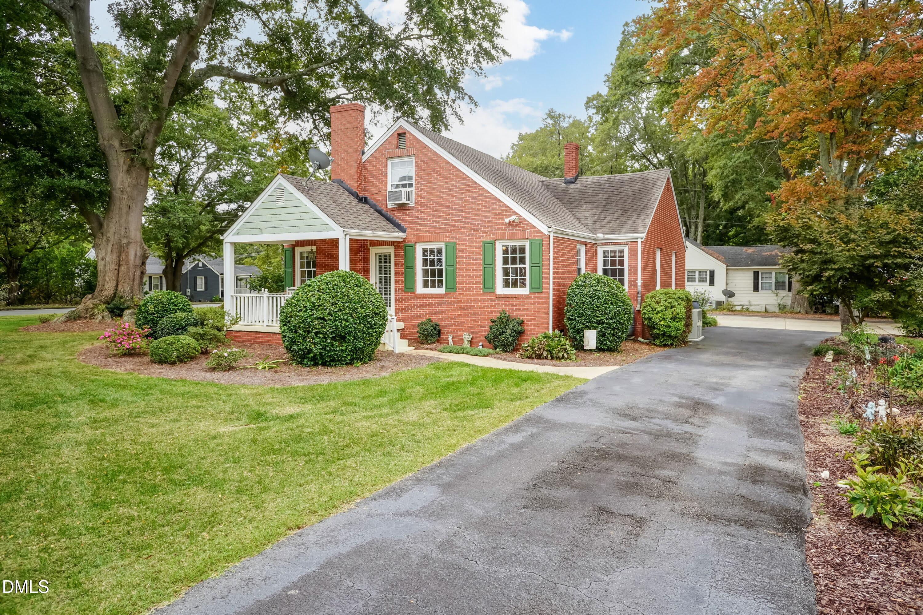 700 St Marys Street Garner, NC 27529 - Photo 48 of 51 a front view of a house with a garden