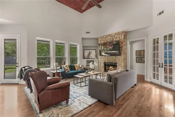 a living room with furniture and a fireplace