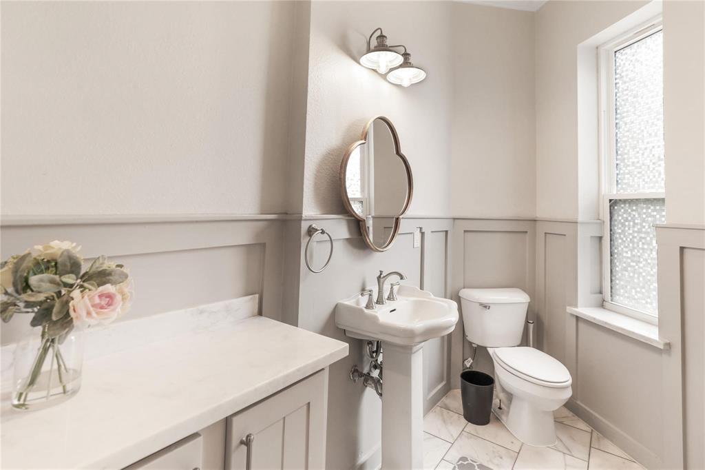 1751 Spring Mountain Road Cross Roads, TX 76227 - Photo 26 of 38 a bathroom with a toilet sink and mirror
