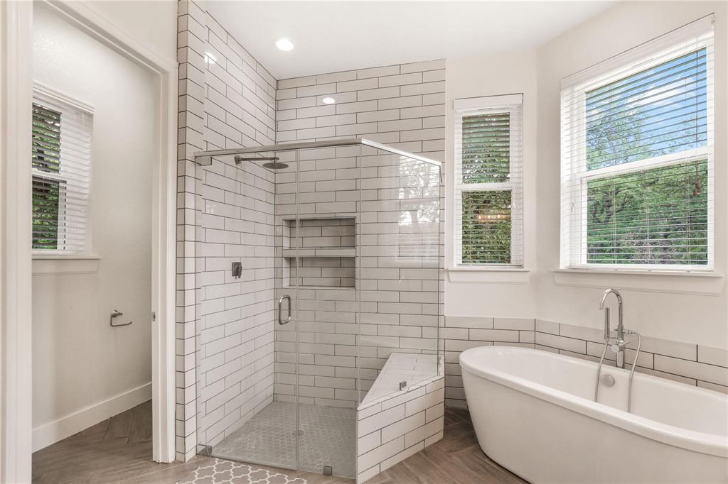 1751 Spring Mountain Road Cross Roads, TX 76227 - Photo 28 of 38 a bathroom with a bathtub and window