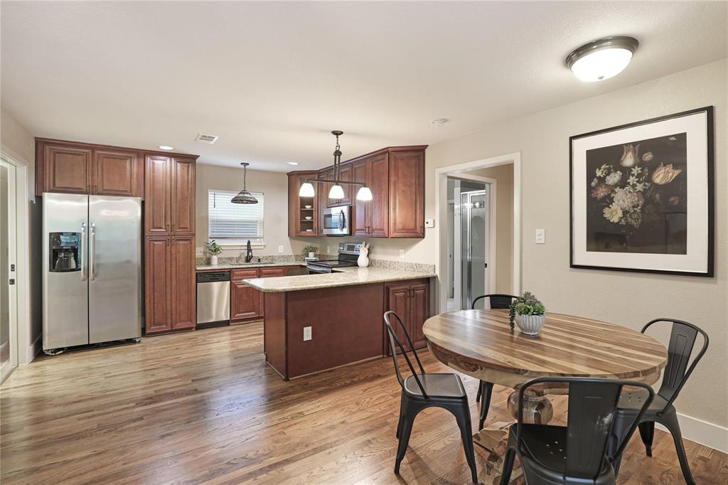 1751 Spring Mountain Road Cross Roads, TX 76227 - Photo 30 of 38 a kitchen with a table and chairs in it
