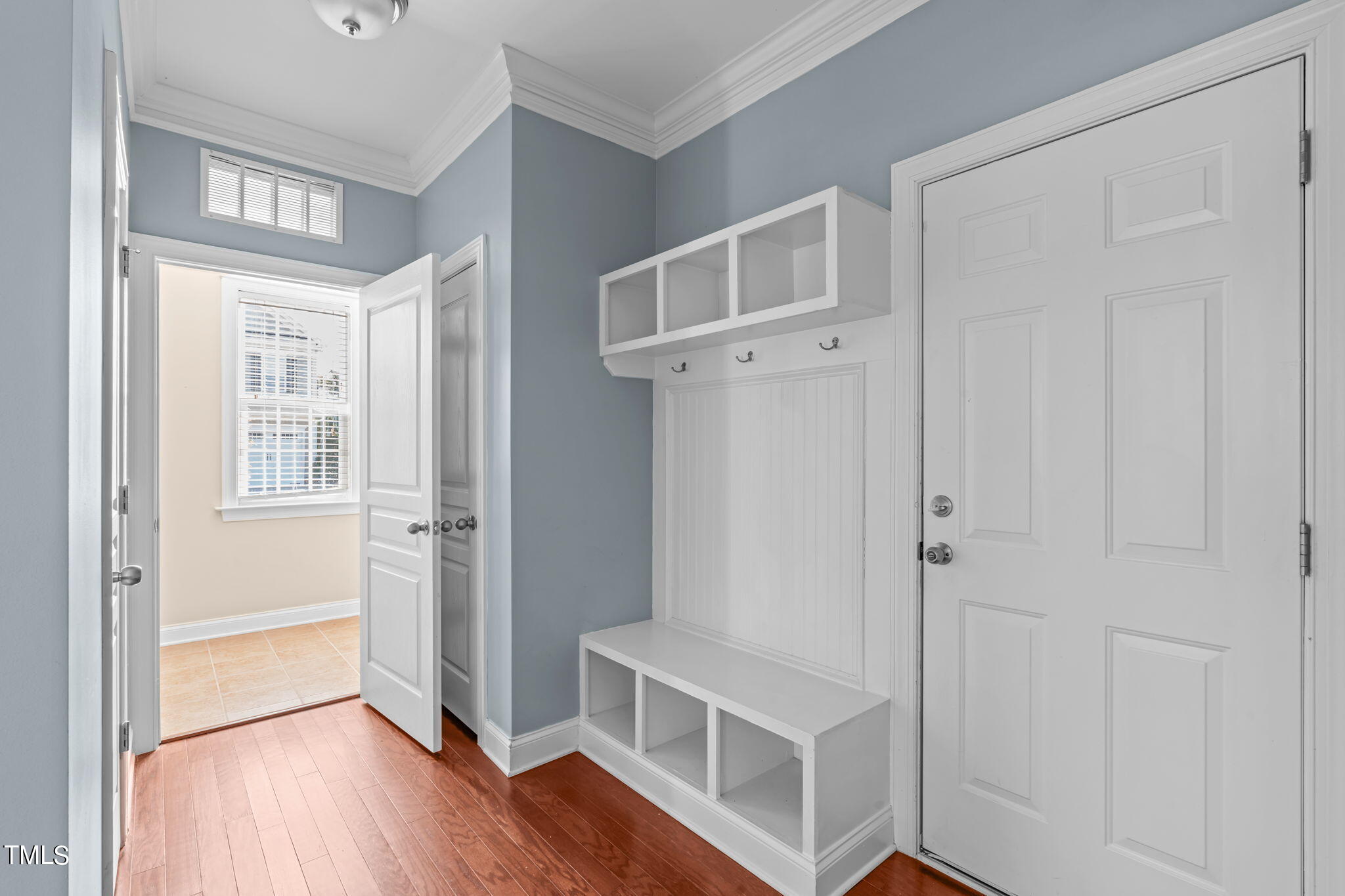 601 Democracy Street Raleigh, NC 27603 - Photo 12 of 24 a view of a livingroom with wooden floor and entryway