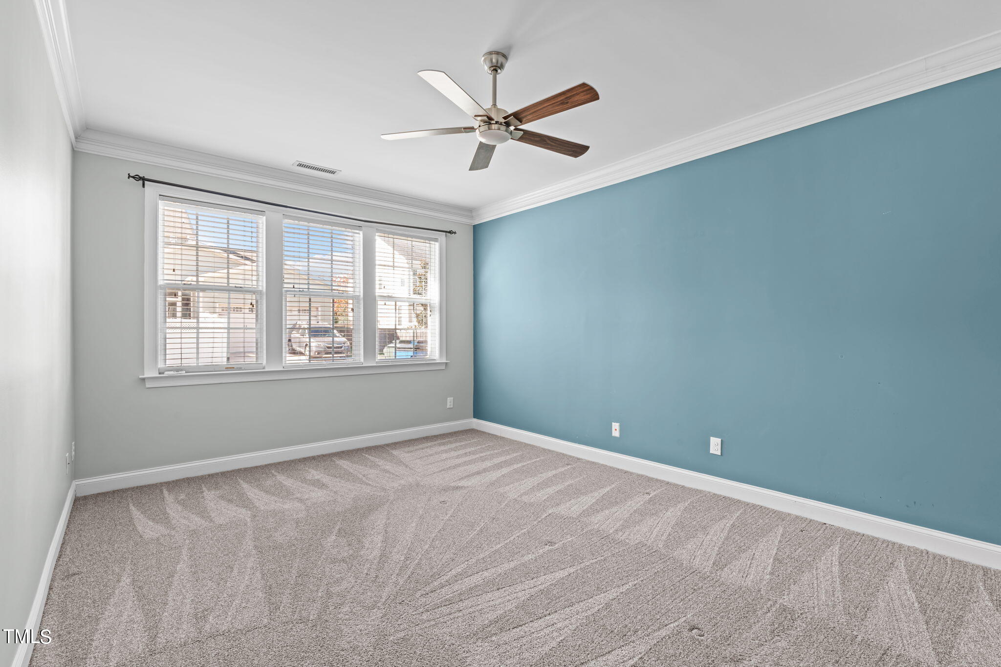 601 Democracy Street Raleigh, NC 27603 - Photo 13 of 24 wooden floor in an empty room with a window