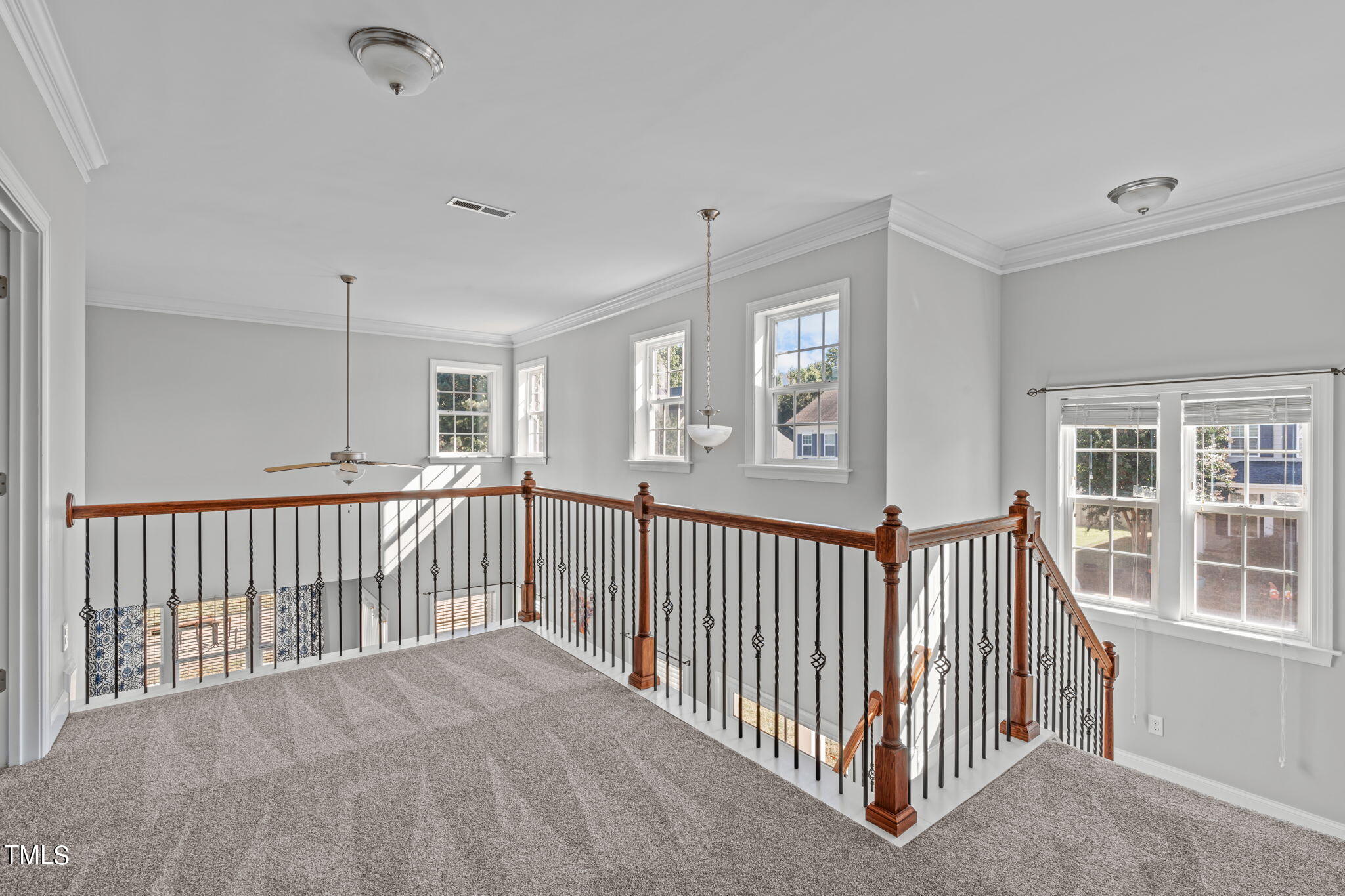601 Democracy Street Raleigh, NC 27603 - Photo 16 of 24 a view of a hallway with windows