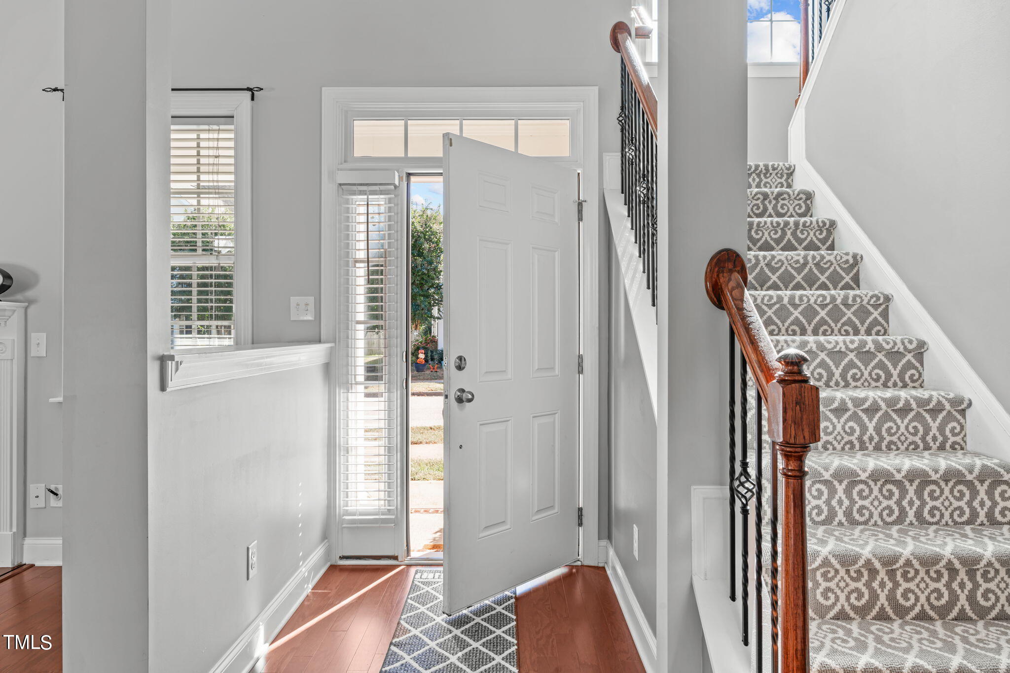 601 Democracy Street Raleigh, NC 27603 - Photo 3 of 24 a view of front door with wooden floor