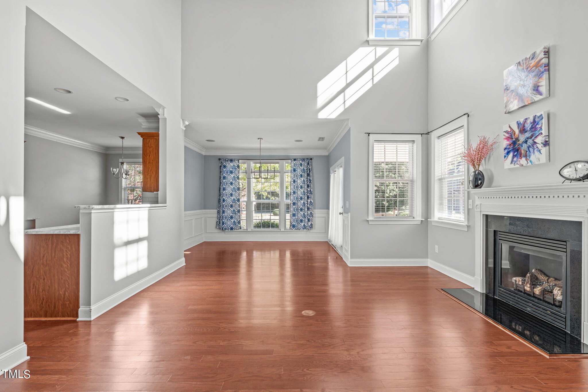 601 Democracy Street Raleigh, NC 27603 - Photo 4 of 24 a view of an empty room with wooden floor and a window