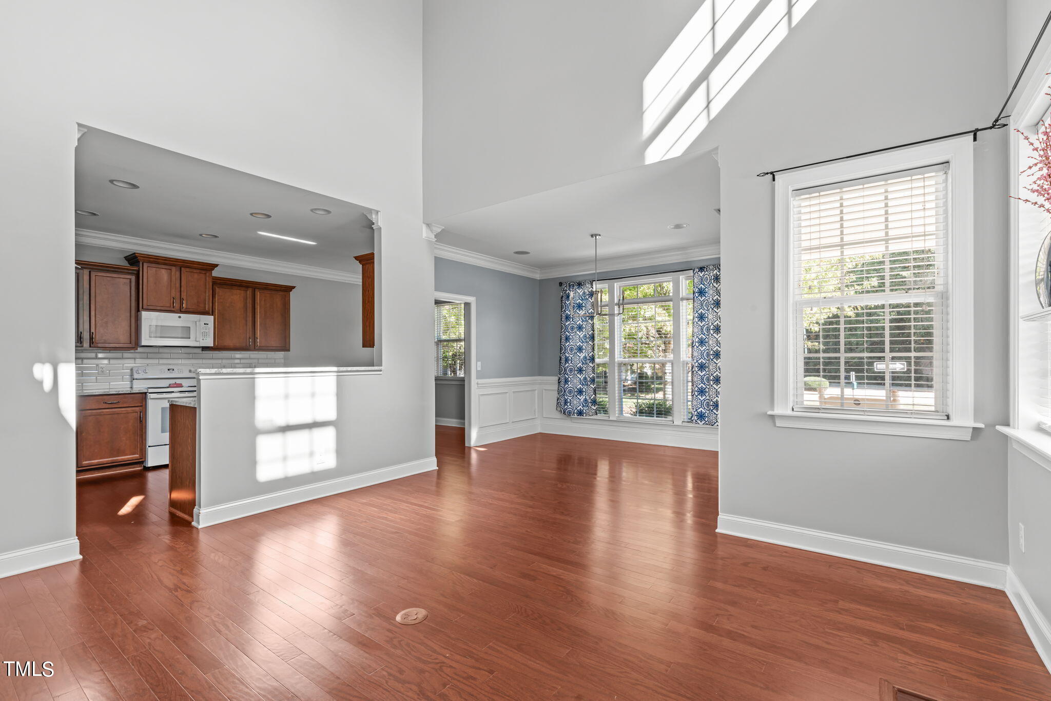 601 Democracy Street Raleigh, NC 27603 - Photo 7 of 24 wooden floor in an empty room with a window
