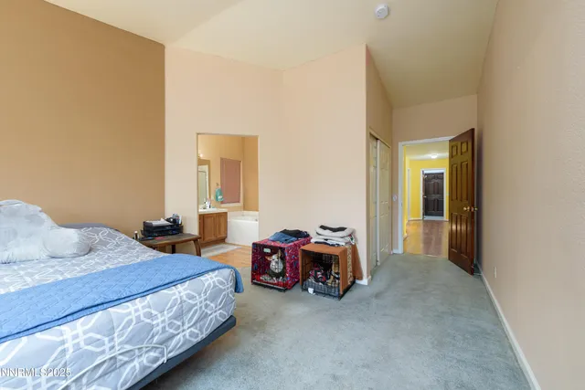 a bedroom with bed and a window