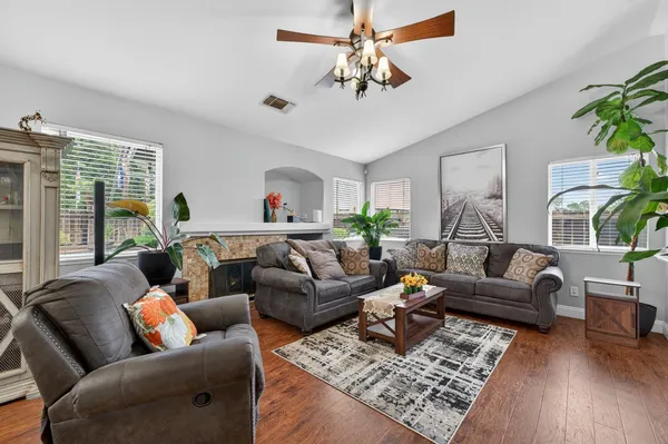 a living room with furniture and a large window
