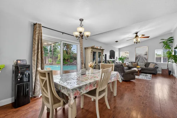 a view of a dining room with furniture window and wooden floor