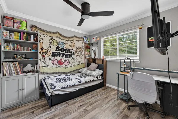a bedroom with furniture and a window