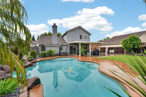 a view of a house with swimming pool