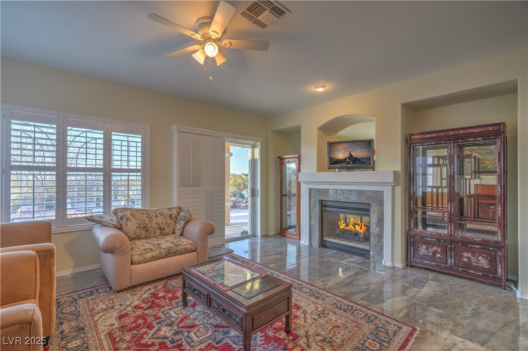 3002 Hickory Valley Road Henderson, NV 89052 - Photo 12 of 58 SEPARATE FAMILY ROOM WITH
CEILING FAN, AND 2-WAY GAS
FIREPLACE