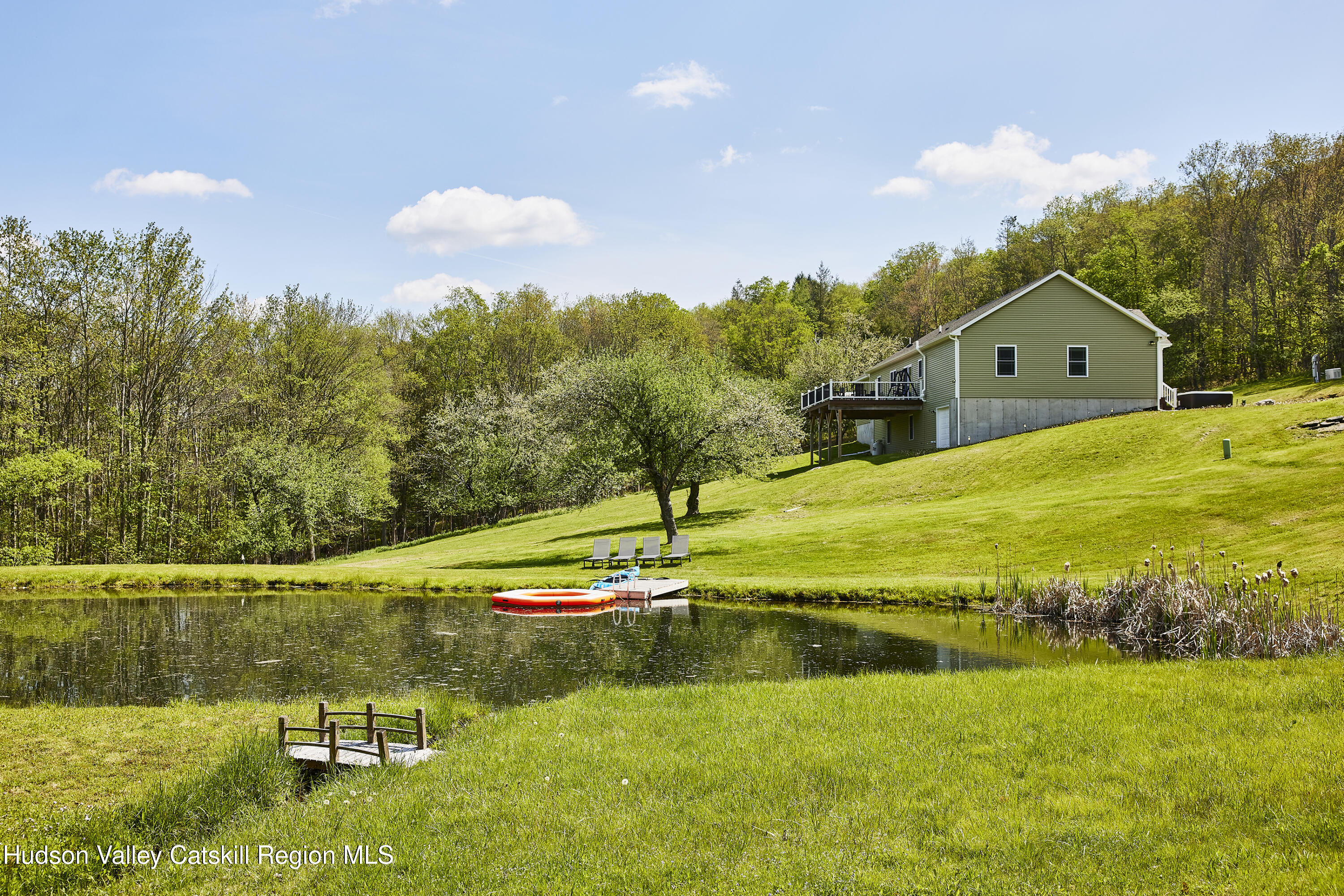55 Hunter Road Parksville, NY 12768 - Photo 2 of 35 a view of a lake with a yard