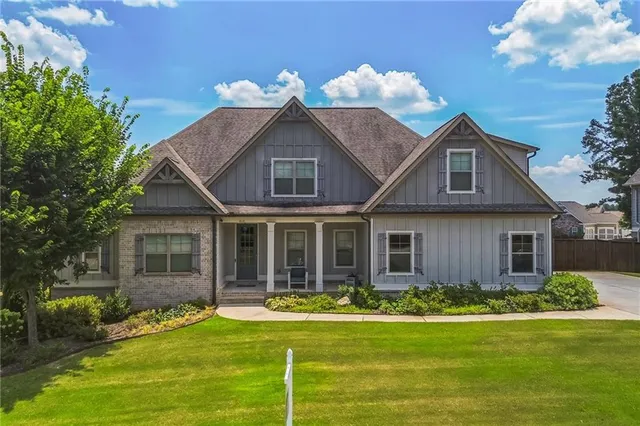 a front view of a house with a yard