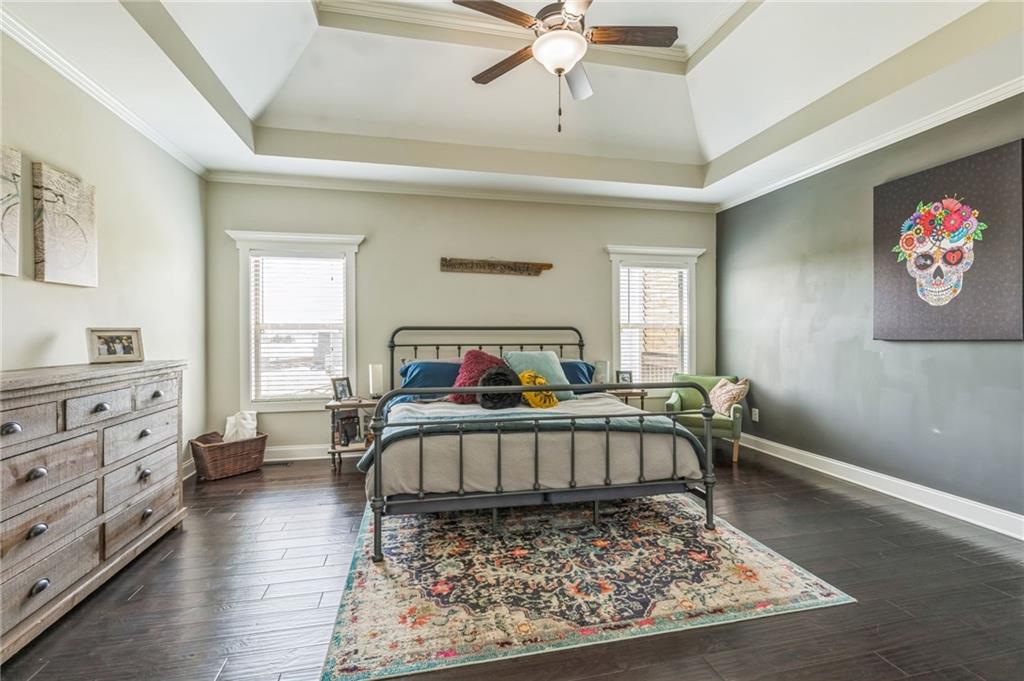 1621 Highland Creek Drive Monroe, GA 30656 - Photo 18 of 54 a bed room with a bed and a chandelier