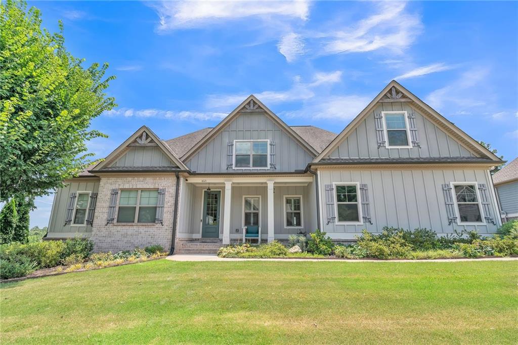 1621 Highland Creek Drive Monroe, GA 30656 - Photo 2 of 54 a front view of a house with a yard