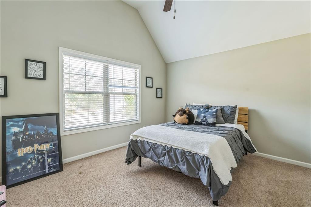 1621 Highland Creek Drive Monroe, GA 30656 - Photo 28 of 54 a bed sitting in a bedroom next to a window