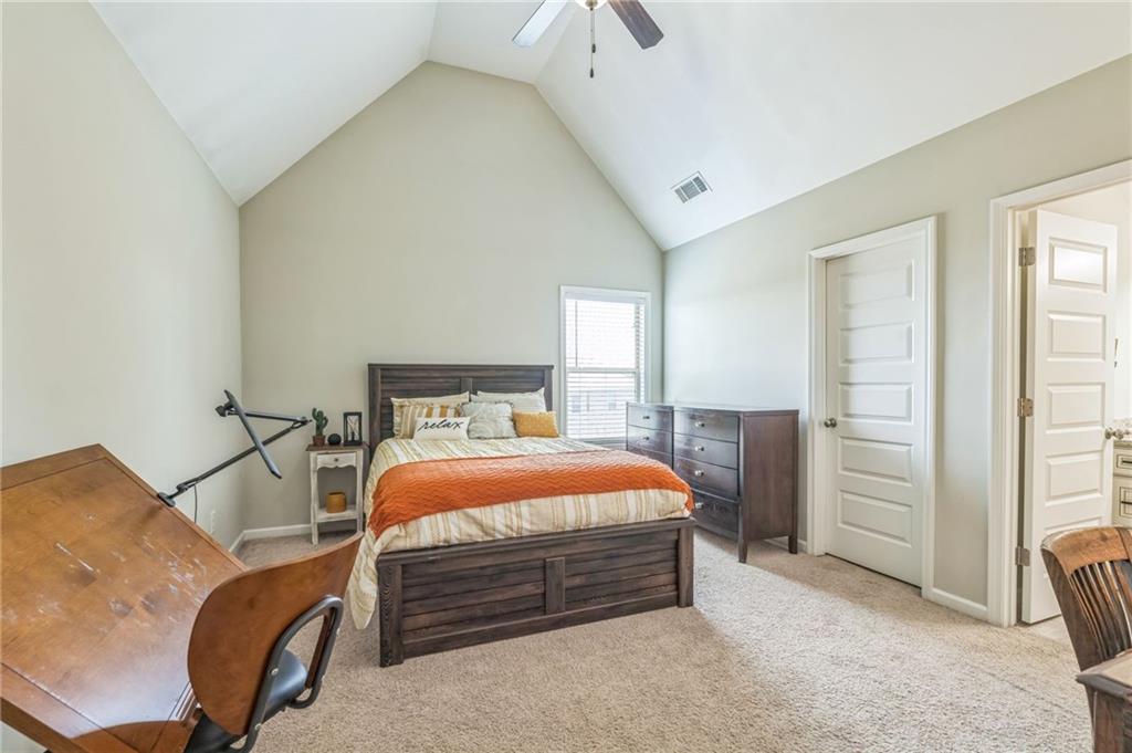 1621 Highland Creek Drive Monroe, GA 30656 - Photo 30 of 54 a bedroom with a bed and a cabinets