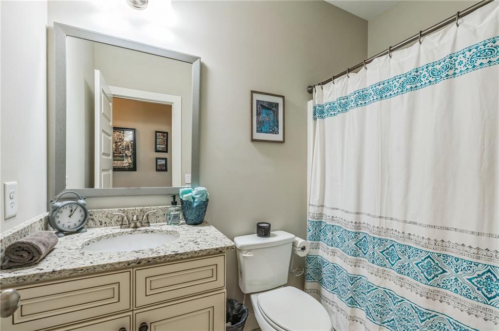 1621 Highland Creek Drive Monroe, GA 30656 - Photo 33 of 54 a bathroom with a granite countertop sink and a mirror