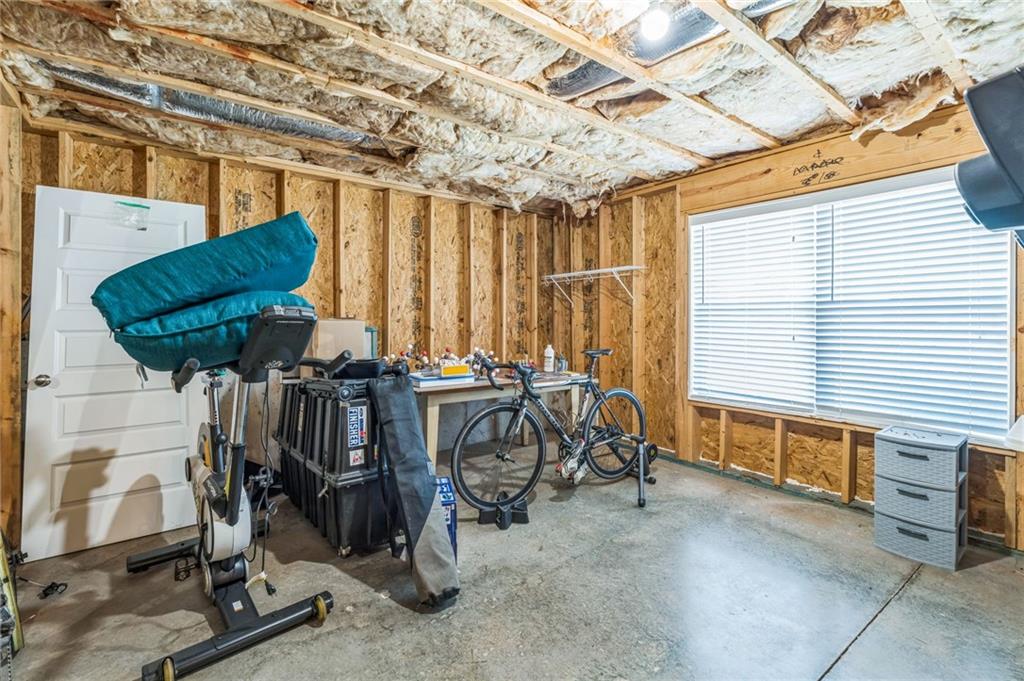 1621 Highland Creek Drive Monroe, GA 30656 - Photo 35 of 54 a view of a room with gym equipment
