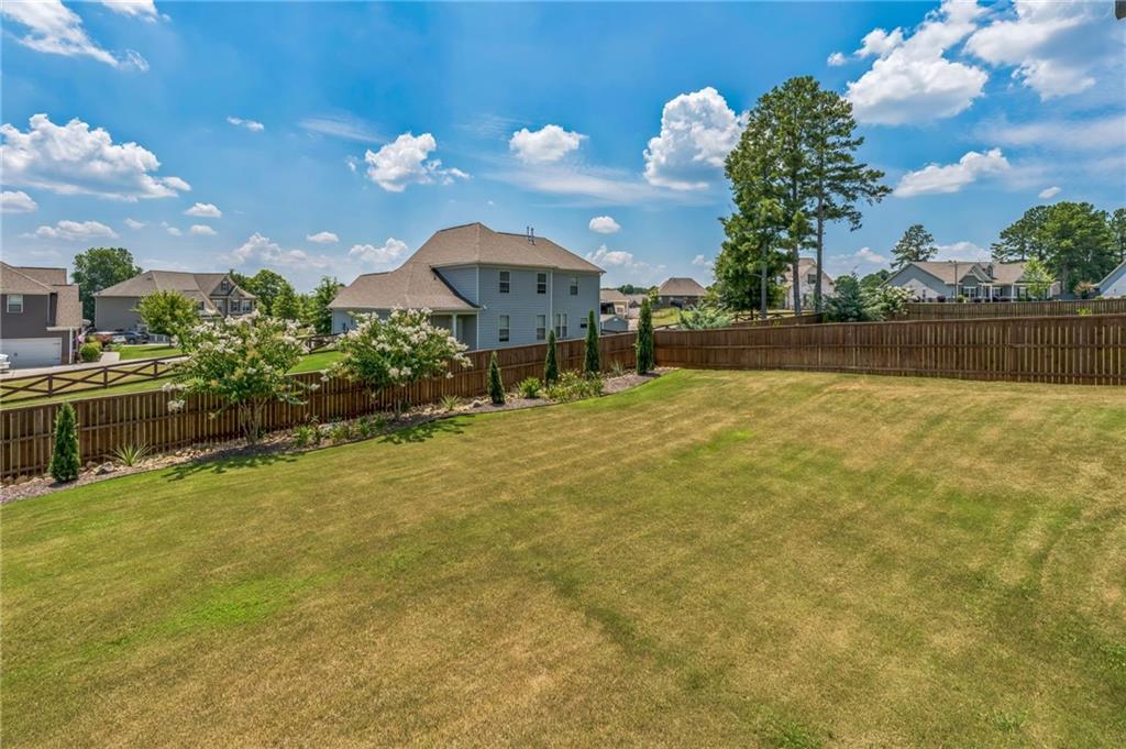 1621 Highland Creek Drive Monroe, GA 30656 - Photo 40 of 54 a swimming pool with outdoor seating and yard