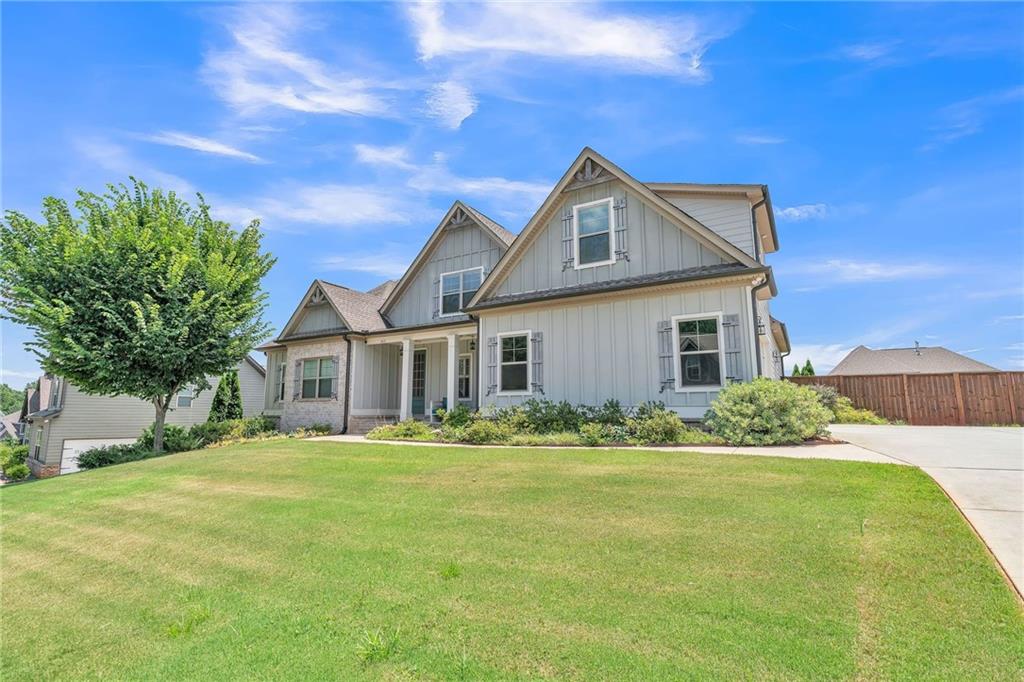 1621 Highland Creek Drive Monroe, GA 30656 - Photo 4 of 54 a front view of a house with a yard