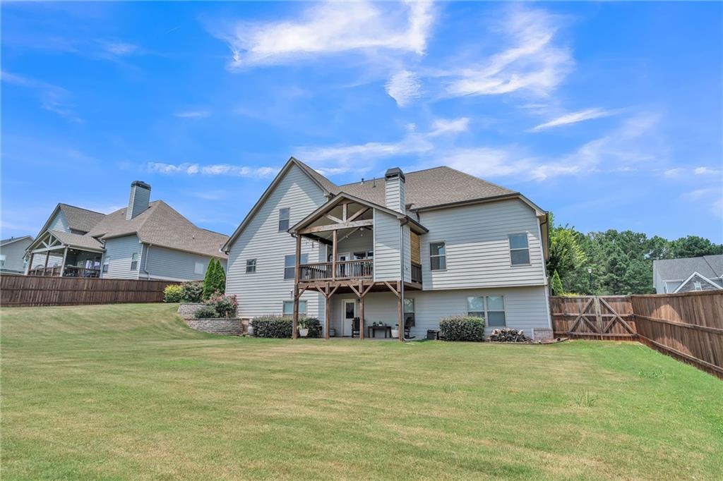 1621 Highland Creek Drive Monroe, GA 30656 - Photo 42 of 54 a house view with a garden space
