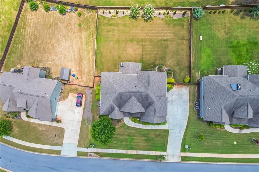 1621 Highland Creek Drive Monroe, GA 30656 - Photo 49 of 54 an aerial view of residential house with pool and yard