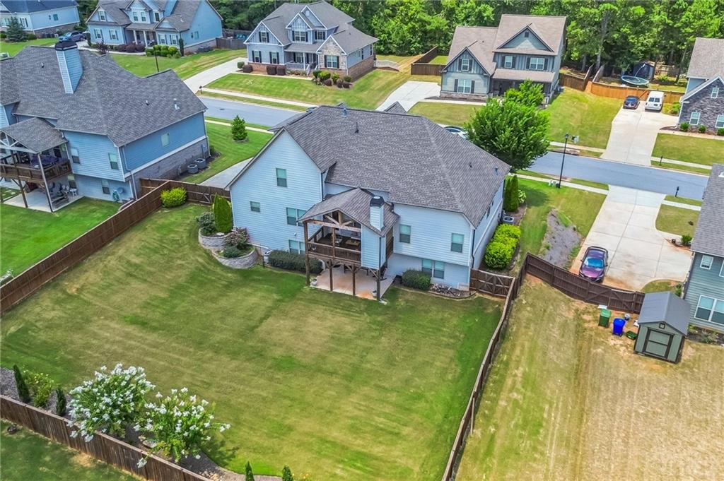 1621 Highland Creek Drive Monroe, GA 30656 - Photo 50 of 54 an aerial view of a house with swimming pool and large trees