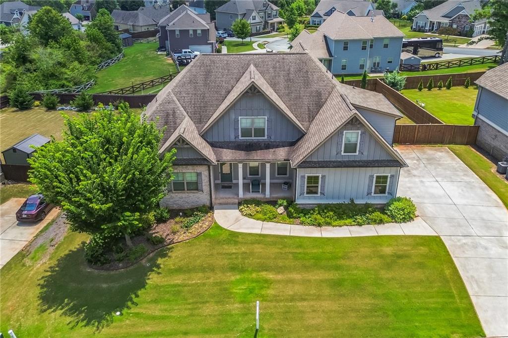 1621 Highland Creek Drive Monroe, GA 30656 - Photo 54 of 54 a aerial view of a house with a yard table and chairs