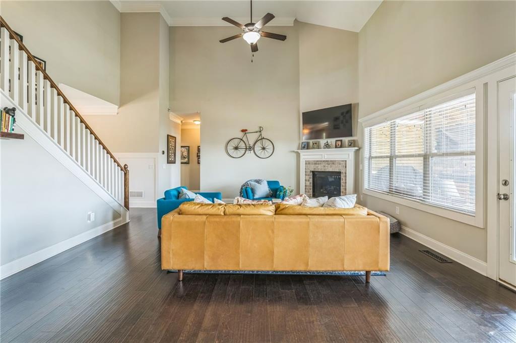 1621 Highland Creek Drive Monroe, GA 30656 - Photo 10 of 54 a living room with fireplace furniture and a flat screen tv